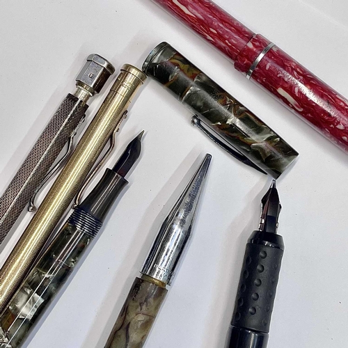 54 - A Watermans fountain pen, three others, a silver Yard-o-led pencil and two others (7).