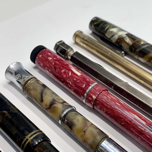 54 - A Watermans fountain pen, three others, a silver Yard-o-led pencil and two others (7).