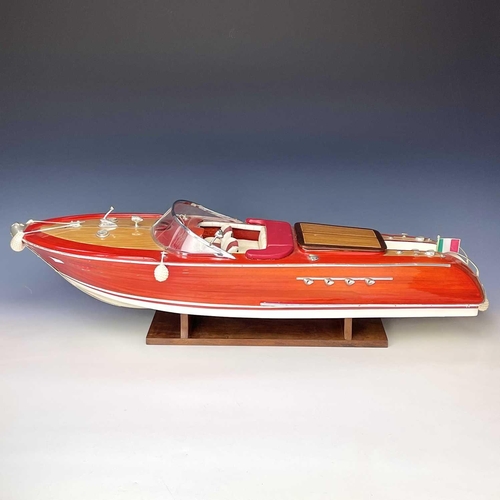 58 - A well made Riva Aquarama model speedboat with remote control and accessories including fitted stand... 