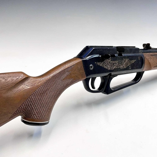 59 - A Power Line .22 underlever pump-up air rifle, with wood effect stock, length 96cm. Purchasers pleas... 