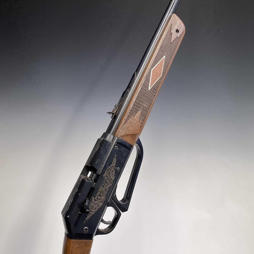 59 - A Power Line .22 underlever pump-up air rifle, with wood effect stock, length 96cm. Purchasers pleas... 