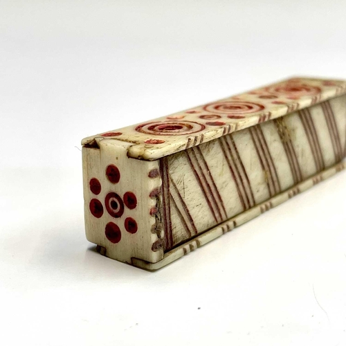 62 - A set of Napoleonic bone prisoner of war miniature dominoes, the case with sliding lid and red incis... 