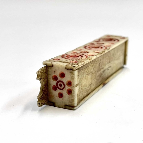 62 - A set of Napoleonic bone prisoner of war miniature dominoes, the case with sliding lid and red incis... 