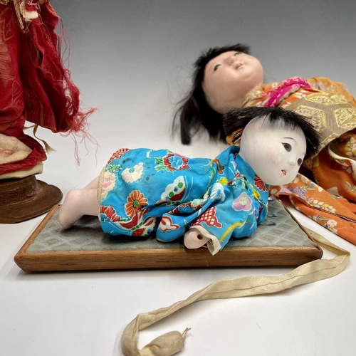 68 - A Japanese composition head doll, 20th century, in traditional costume, height 48cm, together with t... 