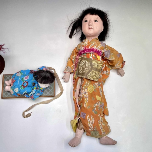 68 - A Japanese composition head doll, 20th century, in traditional costume, height 48cm, together with t... 