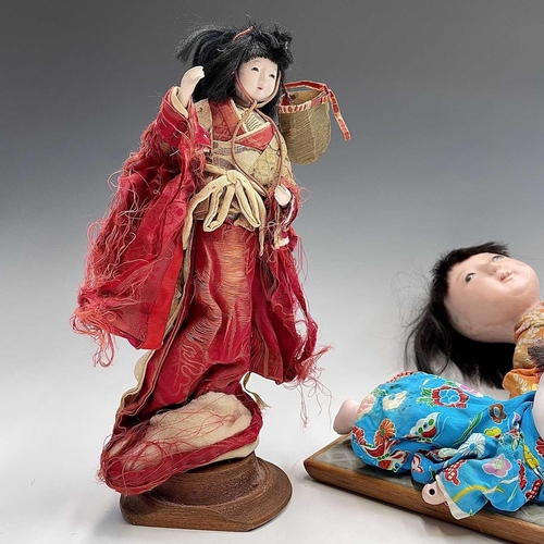 68 - A Japanese composition head doll, 20th century, in traditional costume, height 48cm, together with t... 