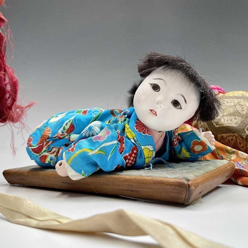 68 - A Japanese composition head doll, 20th century, in traditional costume, height 48cm, together with t... 