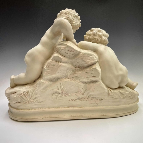 72 - A large oval composite resin figure group of putti resting at a cascade, height 46cm width 61cm dept... 