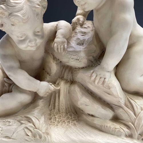 72 - A large oval composite resin figure group of putti resting at a cascade, height 46cm width 61cm dept... 