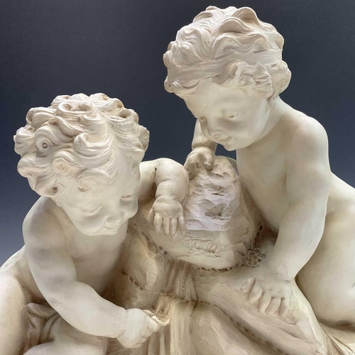 72 - A large oval composite resin figure group of putti resting at a cascade, height 46cm width 61cm dept... 