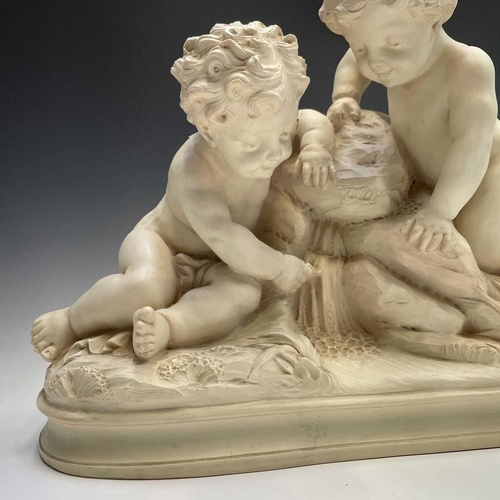 72 - A large oval composite resin figure group of putti resting at a cascade, height 46cm width 61cm dept... 