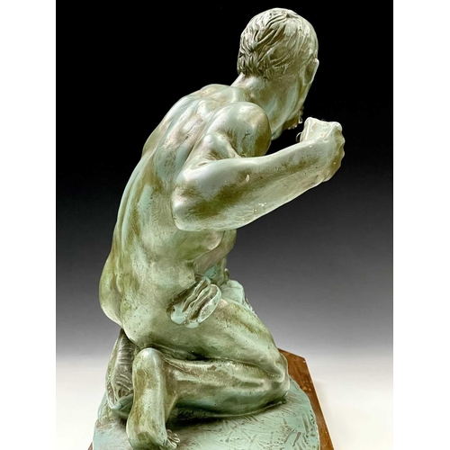 73 - An Art Deco plaster sculpture of a male archer signed Risault on an octagonal wooden base, height 37... 