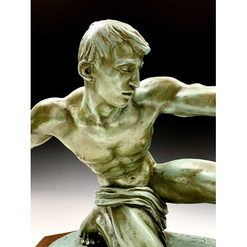 73 - An Art Deco plaster sculpture of a male archer signed Risault on an octagonal wooden base, height 37... 