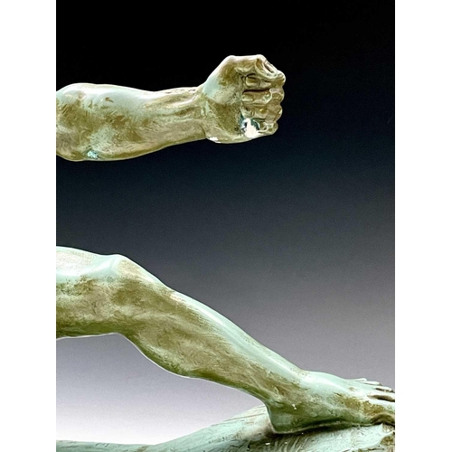 73 - An Art Deco plaster sculpture of a male archer signed Risault on an octagonal wooden base, height 37... 