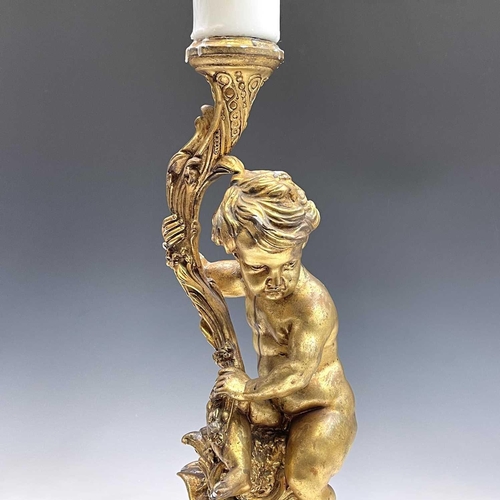 80 - A giltwood gesso figure of putto holding a cornucopia, height 70cm diameter 25cm.