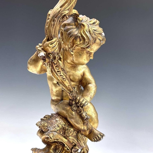 80 - A giltwood gesso figure of putto holding a cornucopia, height 70cm diameter 25cm.