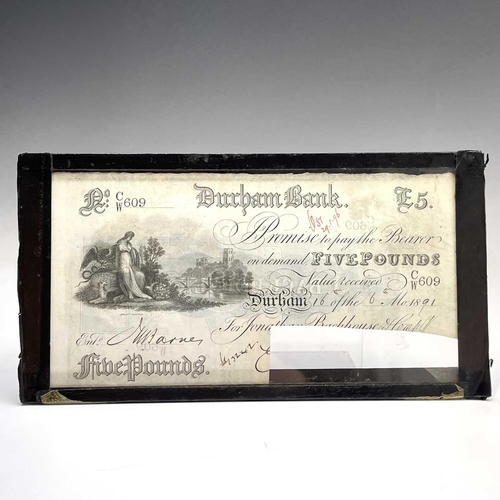 82 - A Durham bank £5 note, dated 1891, cut cancelled, 10.5 X 20.5cm and a similar Stockton on Tees bank ... 