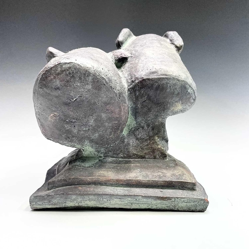 91 - A heavy bronzed composition sculpture of a pair of greyhound heads, on a plinth base. Height 29cm, w... 