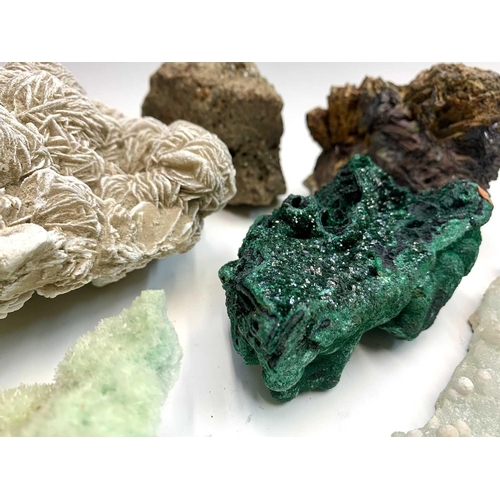 93 - An interesting collection of eight identified mineral specimens comprising, malachite, smokey quartz... 