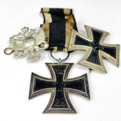 200 - Germany - Iron Crosses (x2). Lot comprises First World War Iron Cross complete with ribbon, a World ... 