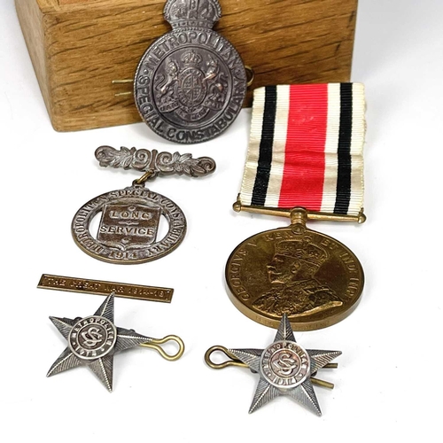 205 - World War I Metropolitan, etc. Police Medals and Badges. Lot comprises a Special Constabulary Long S... 