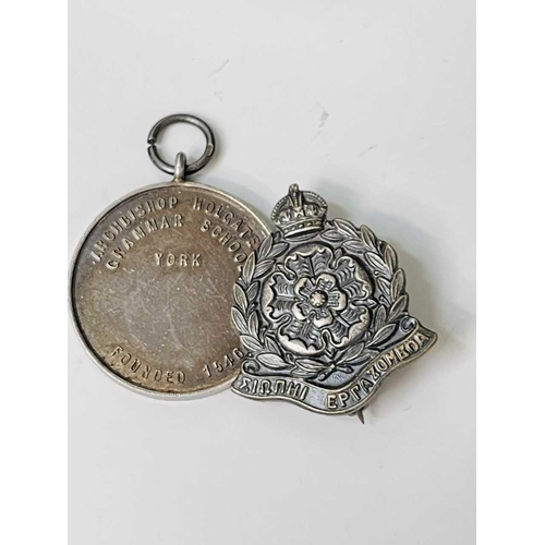 254 - Military and other Medals and Badges. A hallmarked silver Army Rifle Association medal, an A.C.C. 