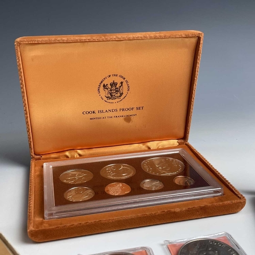 41 - Cook Islands Proof Coinage. Lot comprises 1975 boxed proof set from 1 cent to $1, 1977 boxed $5 silv... 