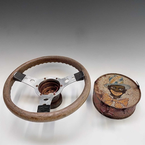 607 - A Mountney steering wheel, ash laminated, together with a litho tin plate toy drum (2)