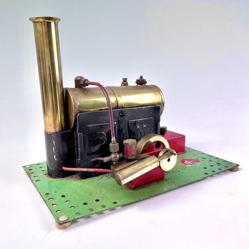 622 - Bowman Stationary Engine. A Bowman brass stationary engine on green metal base. (24cm x 15cm).