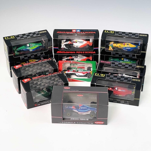 633 - Formula 1 / Indi Cars 1/43rd Scale Die Cast Boxed Racing Cars. A box containing 12 boxed cars in goo... 