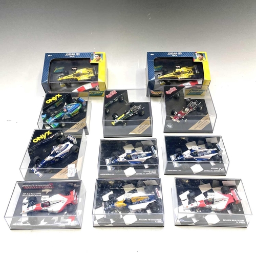 634 - Formula 1 1/43rd Scale Die Cast Boxed Racing Cars. A box containing 11 boxed cars in good condition.... 