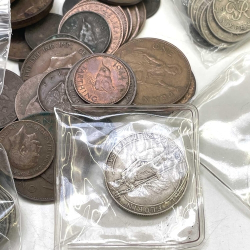 65 - Great Britain and World Coinage including Silver Coins. A tin consisting £1.05 of pre 1947 GB silver... 