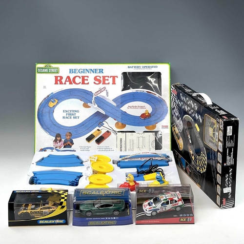 661 - Slot Racing including Scalextric items. Lot comprises 2 boxed racing sets: 