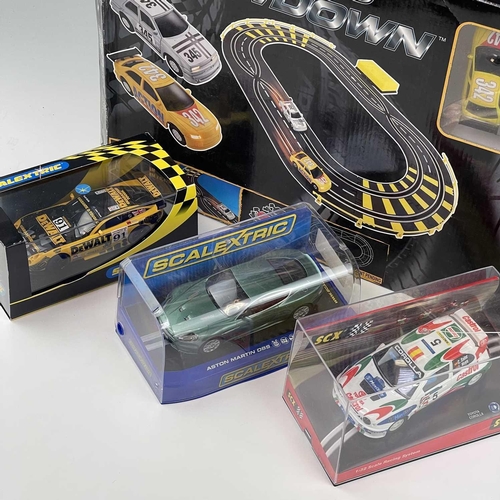 661 - Slot Racing including Scalextric items. Lot comprises 2 boxed racing sets: 