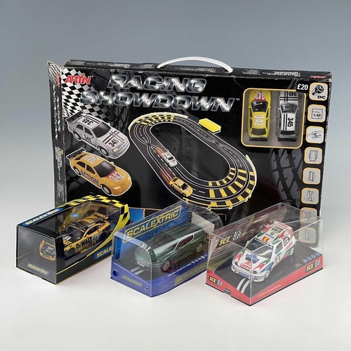 661 - Slot Racing including Scalextric items. Lot comprises 2 boxed racing sets: 