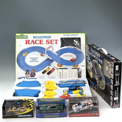 661 - Slot Racing including Scalextric items. Lot comprises 2 boxed racing sets: 