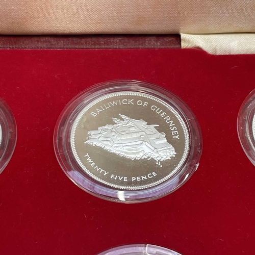 69 - Silver G.B and Commonwealth Proof Silver Crown Sized Coins (x8). A cased Pobjoy mint set of 8 proof ... 