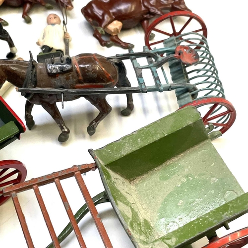 754 - Britains and other Lead Farm Animals and Farm items. Lot includes 5 horsedrawn vehicles (mainly cart... 