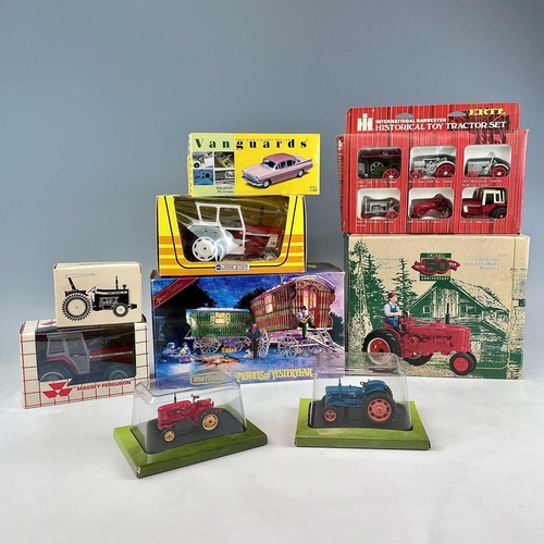 760 - Boxed Tractors, etc. A box containing 7 boxed tractors by Erth, Lone Star, etc. Lot also includes a ... 