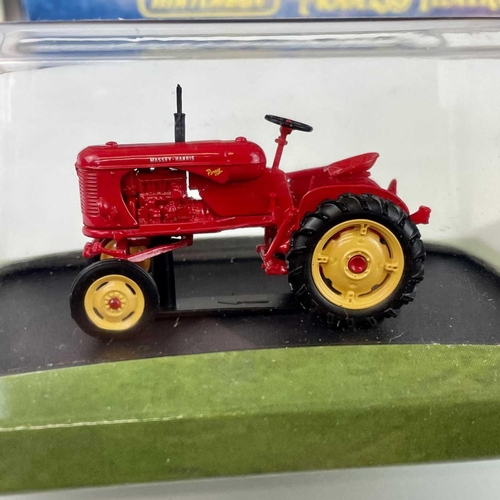 760 - Boxed Tractors, etc. A box containing 7 boxed tractors by Erth, Lone Star, etc. Lot also includes a ... 