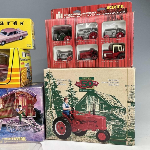 760 - Boxed Tractors, etc. A box containing 7 boxed tractors by Erth, Lone Star, etc. Lot also includes a ... 