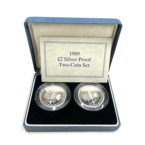 77 - G.B Silver Proof Cased £2 Coins (5 in all). Comprising cased 1986 £2 Commonwealth Games, cased 1989 ... 