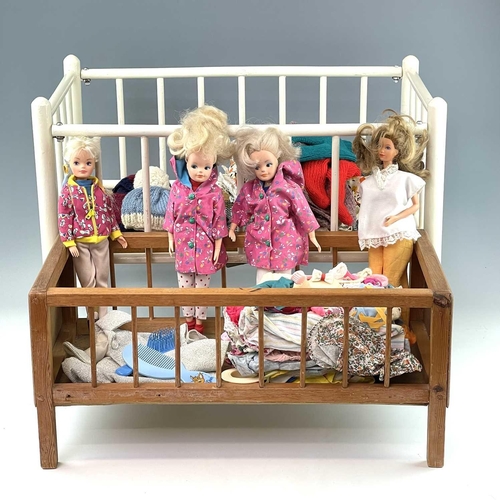 783 - Children's Toy/Dolls Cots (x2), Dolls, etc. Comprising a Triang Toys metal sprung cot of wooden cons... 