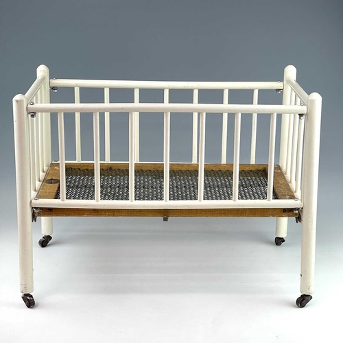 783 - Children's Toy/Dolls Cots (x2), Dolls, etc. Comprising a Triang Toys metal sprung cot of wooden cons... 