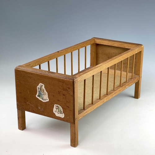 783 - Children's Toy/Dolls Cots (x2), Dolls, etc. Comprising a Triang Toys metal sprung cot of wooden cons... 