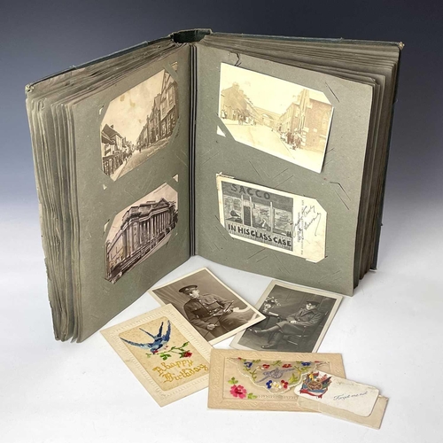 905 - Post Cards. An album containing a quantity of early 20th century cards. Many greeting cards but also... 