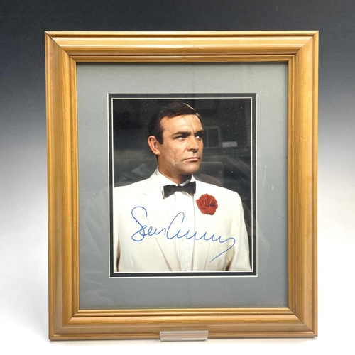 926 - Signed Film/TV Star Photographs. Comprising 2 items: 1: Sean Connery - in iconic James Bond pose. Fr... 