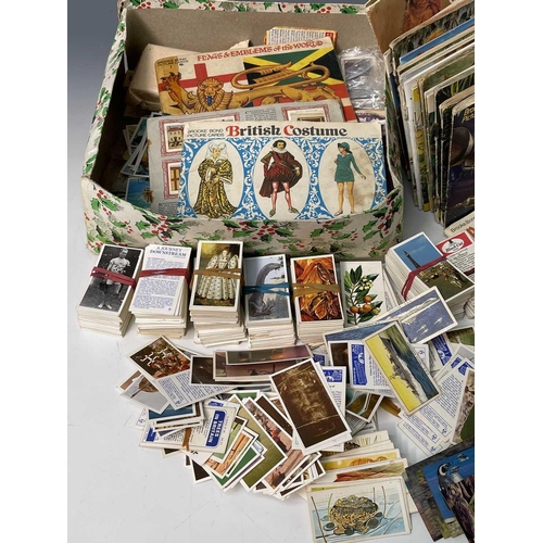 936 - Brooke-Bond and other Trade Cards and some Cigarette cards. A box containing a quantity of trade car... 