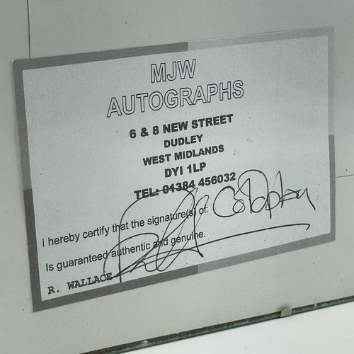 941 - Coldplay Autograph. A framed personally signed score for 