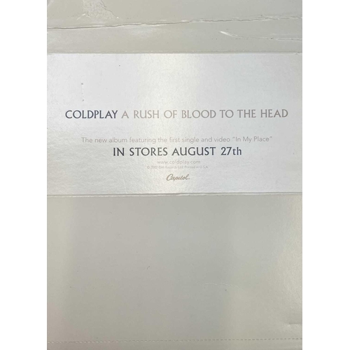 942 - Coldplay Autograph. An advertising display card for 